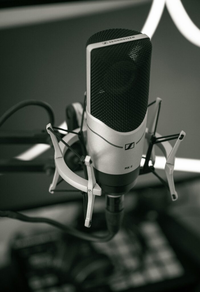 pexels-photo-347700-347700 Close-up of a sleek microphone setup in a modern recording studio, capturing sound with precision.